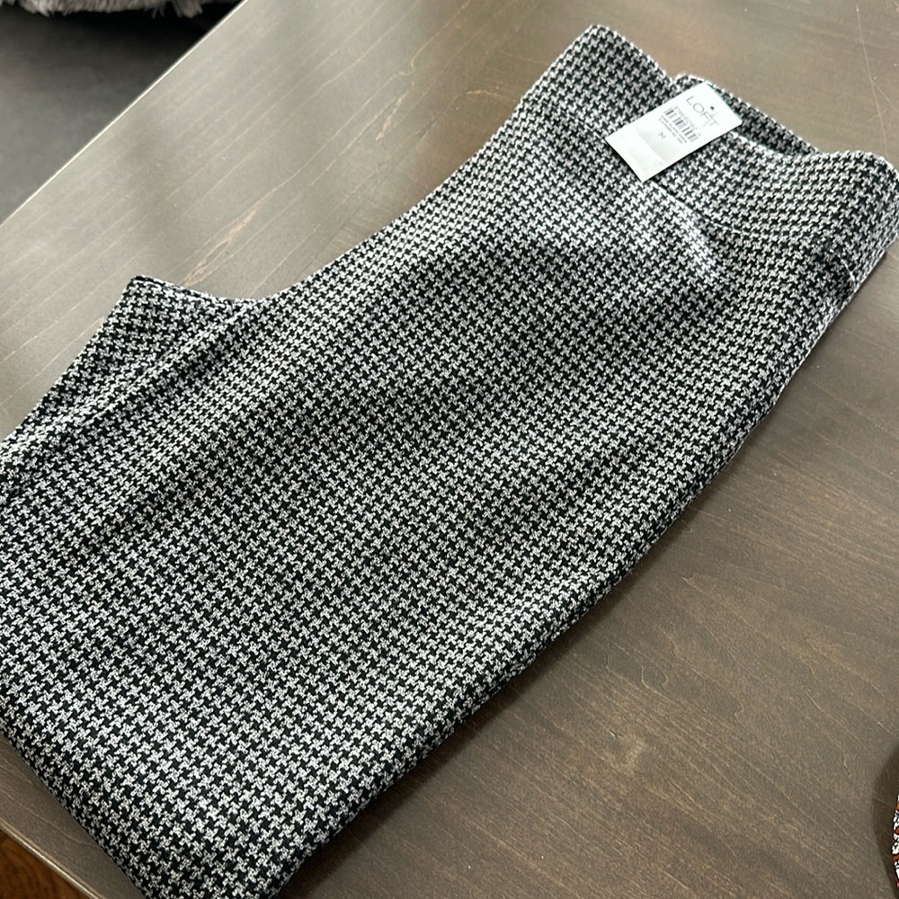 New with tags. Black and gray check leggings